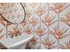 Unique powder room featuring designer wallpaper and a stylish pedestal sink at 1602 Bowery Dr, Raleigh, NC 27607