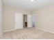 Bedroom featuring neutral walls, carpet, natural light, and doors to other rooms at 161 Walking Path Pl, Hillsborough, NC 27278