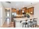 Modern kitchen with stainless steel appliances, ample counter space, and breakfast bar seating at 161 Walking Path Pl, Hillsborough, NC 27278
