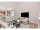 Open-concept layout connecting the living room and kitchen, promoting seamless interaction and modern living at 161 Walking Path Pl, Hillsborough, NC 27278