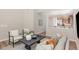 Cozy living area showcasing stylish decor, neutral color palette, and seamless flow into the kitchen at 161 Walking Path Pl, Hillsborough, NC 27278