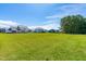 Spacious backyard showcasing the home, surrounding neighborhood, and abundant green space at 173 Vinson Park Dr, Archer Lodge, NC 27527