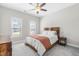 Comfortable bedroom with soft carpet, a bed with wood frame, and great natural light at 173 Vinson Park Dr, Archer Lodge, NC 27527