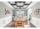 Dining room featuring wood table and chairs, coffered ceiling, and wainscotting at 173 Vinson Park Dr, Archer Lodge, NC 27527