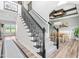 Open foyer with staircase featuring wrought iron spindles and access to dining room at 173 Vinson Park Dr, Archer Lodge, NC 27527