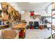 Organized garage with a pegboard wall for tool storage, work bench, and shelving, maximizing space and functionality at 173 Vinson Park Dr, Archer Lodge, NC 27527