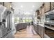 Spacious kitchen featuring stainless steel appliances, ample counter space and eat-in breakfast area at 173 Vinson Park Dr, Archer Lodge, NC 27527
