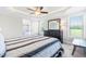 A bright main bedroom with a ceiling fan, and en suite bathroom featuring a glass enclosed shower at 173 Vinson Park Dr, Archer Lodge, NC 27527