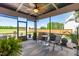 Comfortable screened porch with outdoor furniture, ceiling fan, and backyard views at 173 Vinson Park Dr, Archer Lodge, NC 27527