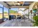 Covered screened porch featuring a ceiling fan, outdoor furniture, and a view of the backyard at 173 Vinson Park Dr, Archer Lodge, NC 27527