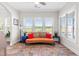 Bright and cheerful sunroom with hardwood floors, ample seating, and large windows at 173 Vinson Park Dr, Archer Lodge, NC 27527