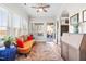 Bright and cheerful sunroom with hardwood floors, ample seating, and natural light at 173 Vinson Park Dr, Archer Lodge, NC 27527