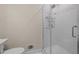 Modern bathroom with tiled shower and glass door, features a built-in shower rack at 1837 Garrett House Trl, Burlington, NC 27215