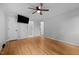 A large bedroom with a TV, closet and ensuite bathroom at 1837 Garrett House Trl, Burlington, NC 27215
