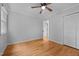 Clean, light-filled bedroom with hardwood floors and closet, great for simple design at 1837 Garrett House Trl, Burlington, NC 27215