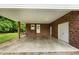 Spacious covered carport with ample lighting, storage, and convenient access to the home at 1837 Garrett House Trl, Burlington, NC 27215