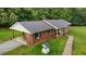Charming brick ranch home with a new roof, covered parking, and well-maintained landscaping at 1837 Garrett House Trl, Burlington, NC 27215