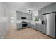 Modern kitchen with stainless steel appliances and a farmhouse sink at 1837 Garrett House Trl, Burlington, NC 27215