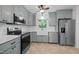 Charming kitchen with updated appliances and stylish cabinetry at 1837 Garrett House Trl, Burlington, NC 27215