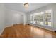 Bright living room with hardwood floors and a large window view at 1837 Garrett House Trl, Burlington, NC 27215