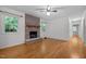 Cozy living room featuring a stone fireplace and hardwood floors at 1837 Garrett House Trl, Burlington, NC 27215