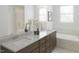 Elegant bathroom with double vanity, soaking tub, and a separate glass shower at 2010 Kapalua Way # 192, Durham, NC 27703