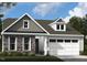 Charming home featuring stone accents, a two-car garage, and a welcoming entrance at 2010 Kapalua Way # 192, Durham, NC 27703
