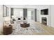 Bright and open living room with fireplace, large windows, and stylish decor at 2010 Kapalua Way # 192, Durham, NC 27703