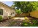 Backyard featuring a concrete pad, fresh mulch, wood fence, and ample green space at 203 Brick St, Wake Forest, NC 27587