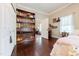 Bedroom featuring a bookshelf, closet, and a peek into the hall at 203 Brick St, Wake Forest, NC 27587