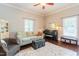 Cozy living room featuring stylish furnishings, natural light and hardwood floors at 203 Brick St, Wake Forest, NC 27587
