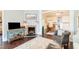 Charming living room featuring a brick fireplace, console, stylish rug, and comfortable seating at 203 Brick St, Wake Forest, NC 27587