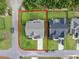 Aerial view highlighting the property's boundaries, showing the house, lawn, and driveway at 211 Education Dr, Spring Lake, NC 28390