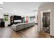 Large basement with a gray sofa, tv, and open door to a bathroom with tiled shower at 211 Education Dr, Spring Lake, NC 28390