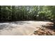 Community basketball court surrounded by lush trees, perfect for friendly games at 211 Education Dr, Spring Lake, NC 28390