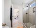 Modern bathroom featuring a glass shower with gray subway tile and a view into the adjacent bedroom at 211 Education Dr, Spring Lake, NC 28390
