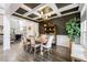 Elegant dining room featuring coffered ceilings, wood floors, and stylish furnishings at 211 Education Dr, Spring Lake, NC 28390