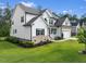 Beautiful home showcasing manicured lawn, brick details, and well-maintained landscaping at 211 Education Dr, Spring Lake, NC 28390