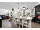 Open-concept kitchen featuring a large island, black and white cabinets, and modern appliances at 211 Education Dr, Spring Lake, NC 28390
