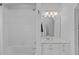 This bathroom features a tub and shower combination with a bright vanity area at 2112 Tulare Ct, Raleigh, NC 27612