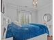 Bright bedroom with a storage bed, white trim, and shuttered windows at 2112 Tulare Ct, Raleigh, NC 27612