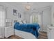 Serene bedroom featuring a stylish bed with storage, soft lighting, and natural light at 2112 Tulare Ct, Raleigh, NC 27612