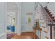 Elegant foyer with hardwood floors, staircase, and access to living spaces at 2112 Tulare Ct, Raleigh, NC 27612