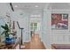 Hallway featuring hardwood floors, staircase and decorative columns at 2112 Tulare Ct, Raleigh, NC 27612