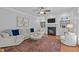 Cozy living room features a fireplace, built-in shelves, and neutral-toned furniture at 2112 Tulare Ct, Raleigh, NC 27612
