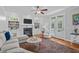 Inviting living room area with a fireplace, built-in bookcases and French doors at 2112 Tulare Ct, Raleigh, NC 27612