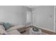 Bright sitting area with chandelier, hardwood floors and a view to the bath at 2112 Tulare Ct, Raleigh, NC 27612