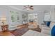 Bright living room with hardwood floors, neutral walls, and French doors at 2112 Tulare Ct, Raleigh, NC 27612