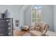 Cozy sitting area with window seat, natural light, and plush armchair at 2112 Tulare Ct, Raleigh, NC 27612