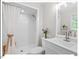 Well-lit bathroom featuring a shower, vanity, and fresh, modern fixtures at 216 Brook Ln, Durham, NC 27712